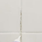 Before and after — mold dissolved on washing machine seal, grout, sink and tile